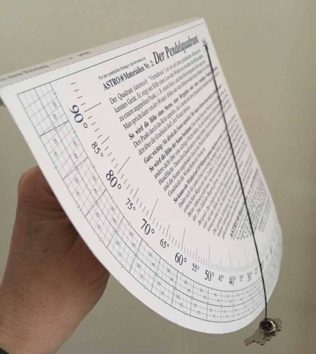 hand holding cardboard clinometer
